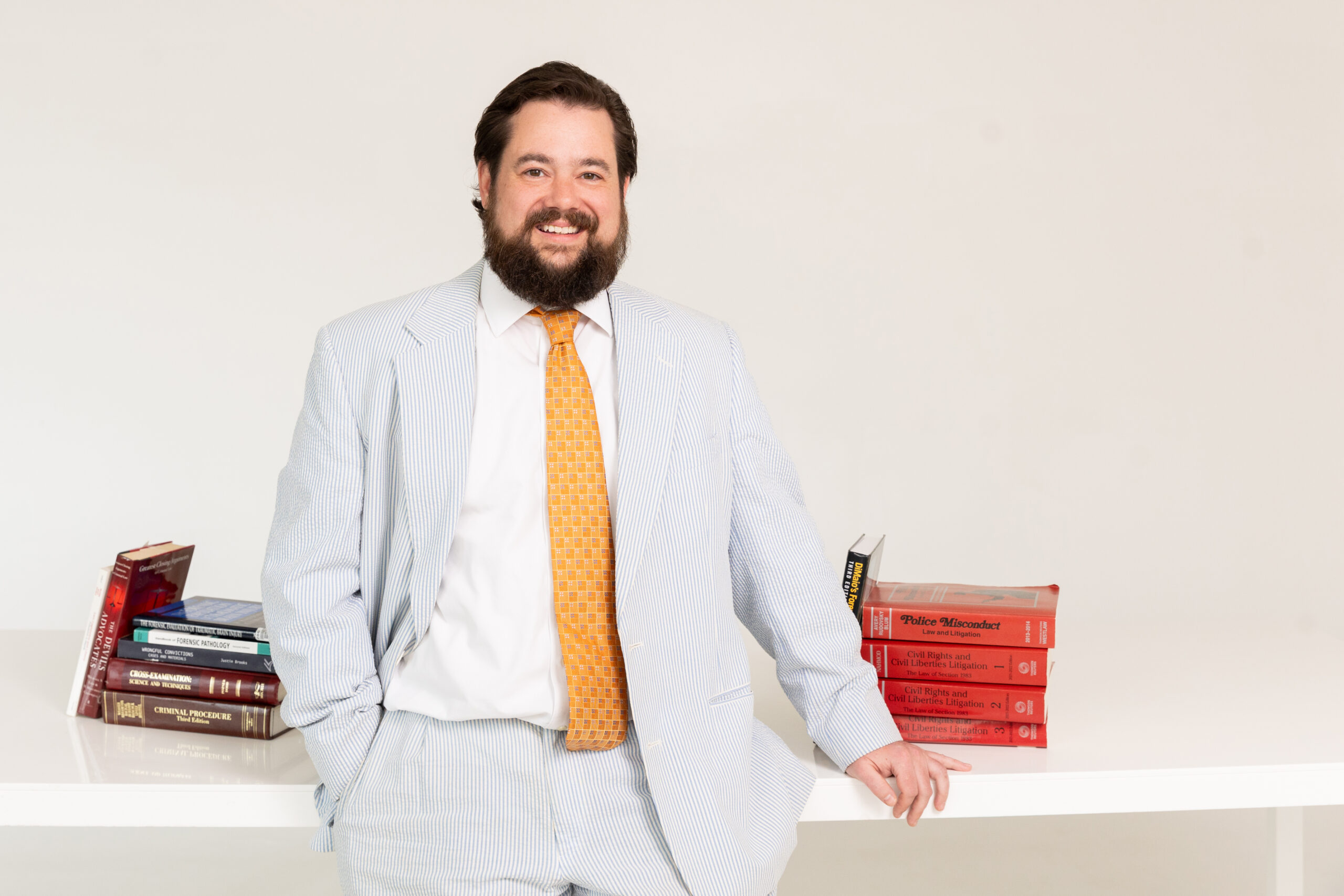 daniel kent standing next to desk