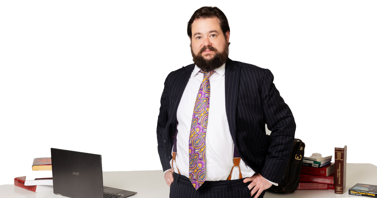 daniel kent lawyer standing by a desk