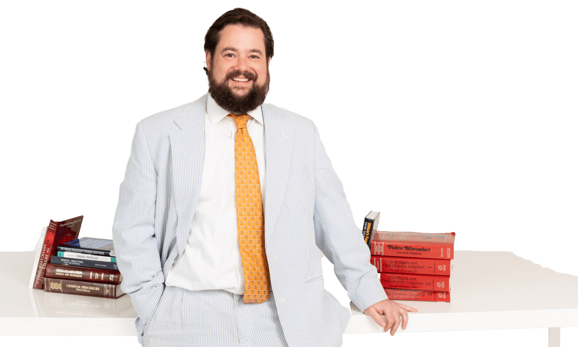 daniel kent lawyer standing next to desk